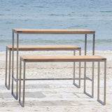 Florence Bar Set 1-2 composé d'une table Florence Bar et de 2 bancs Florence Bar en teck et acier inoxydable